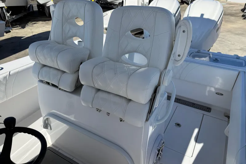 Slide: The Image of 2024 Contender 30 ST boat with luxurious white seating and modern design. - 11