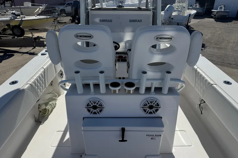 Slide: The Image of 2024 Contender 30 ST boat interior with seating, rod holders, and storage. - 14