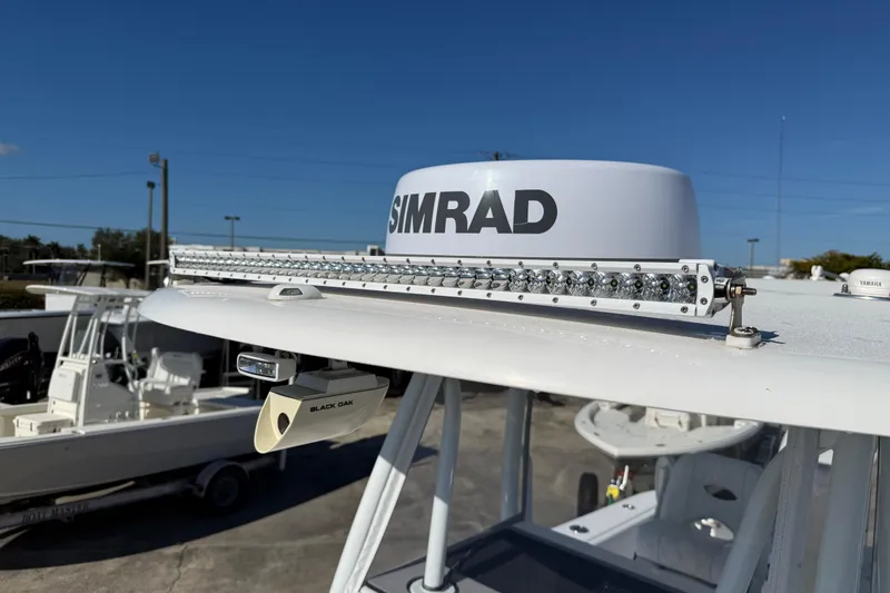 Slide: The Image of 2024 Contender 30 ST boat with Simrad radar and Black Oak light bar. - 2