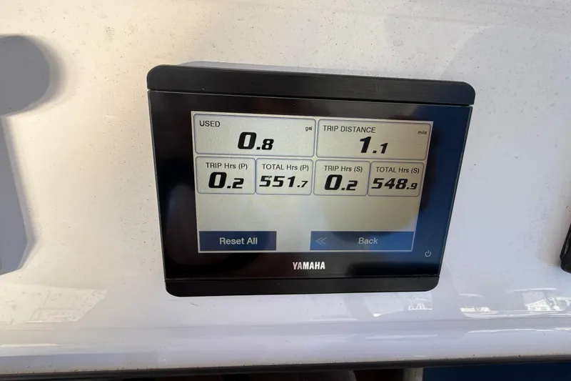 Slide: The Image of Yamaha display showing fuel usage and trip data on 2024 Contender 30 ST boat. - 4