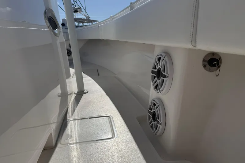 Slide: The Image of 2024 Contender 30 ST boat interior with speakers and sleek design. - 9