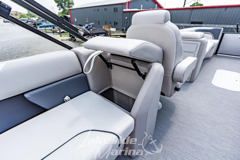 Slide: The Image of 2026 Godfrey Sweetwater 2286 SBC boat interior with plush seating and storage compartment. - 19