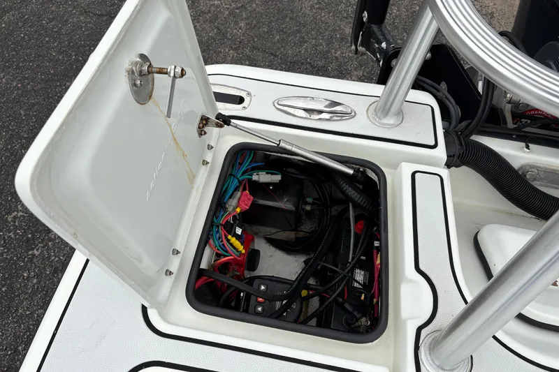 Slide: The Image of Open hatch of 2017 Action Craft Flatsmaster 1820 showing internal wiring and components. - 11