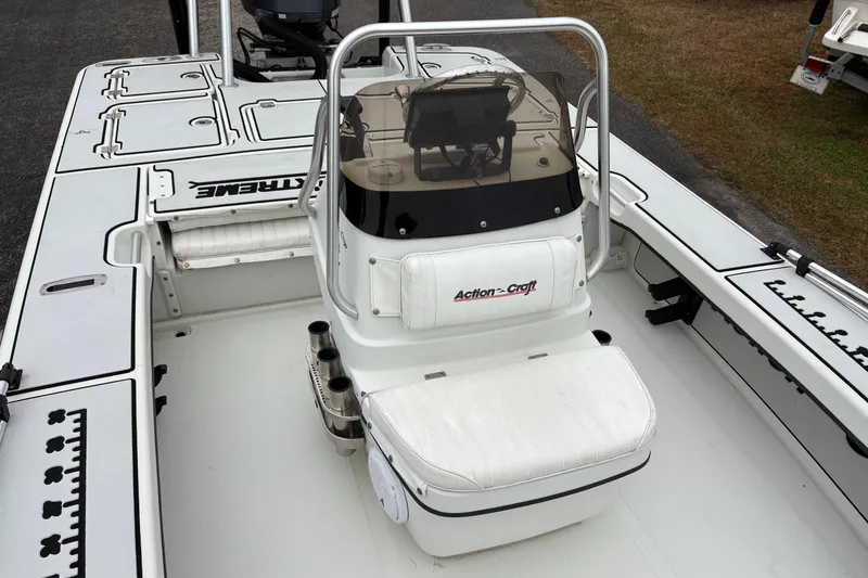 Slide: The Image of 2017 Action Craft Flatsmaster 1820 boat interior with seating and console. - 17