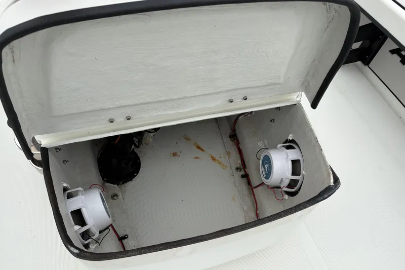 Slide: The Image of Open storage compartment with speakers in a 2017 Action Craft Flatsmaster 1820 boat. - 18