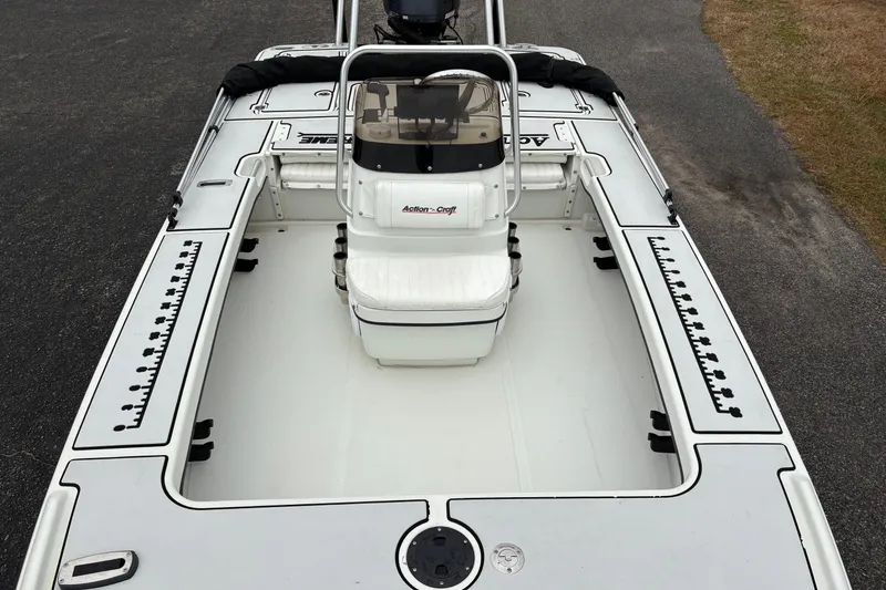 Slide: The Image of 2017 Action Craft Flatsmaster 1820 boat, top view, showcasing spacious deck and seating. - 22