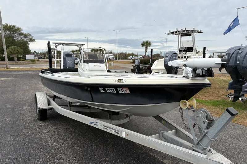 Slide: The Image of 2017 Action Craft Flatsmaster 1820 boat on trailer, parked outdoors. - 6