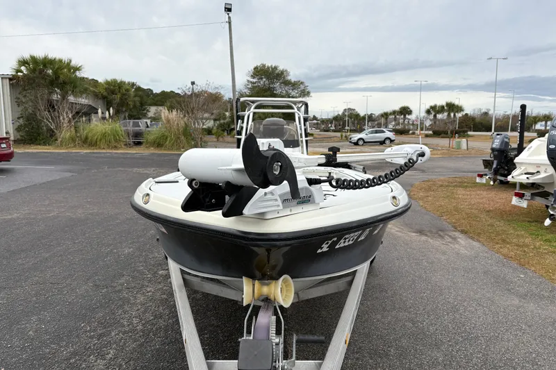 Slide: The Image of 2017 Action Craft Flatsmaster 1820 boat on trailer, equipped with Minn Kota trolling motor. - 7