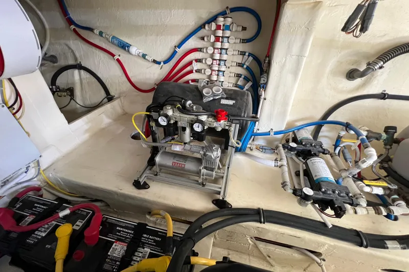 Slide: The Image of Engine room of 2020 Tiara Yachts C44 Coupe with wiring and equipment. - 101