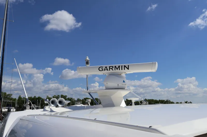 Slide: The Image of 2020 Tiara Yachts C44 Coupe with Garmin radar under a clear blue sky. - 30