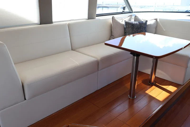 Slide: The Image of Luxurious interior of 2020 Tiara Yachts C44 Coupe with elegant seating and wooden table. - 31