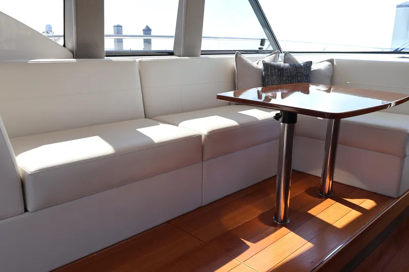 Slide: The Image of Luxurious interior of 2020 Tiara Yachts C44 Coupe with elegant seating and wooden table. - 32