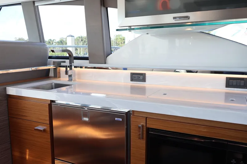 Slide: The Image of Modern kitchen interior of 2020 Tiara Yachts C44 Coupe with sleek countertops and stainless appliances. - 40