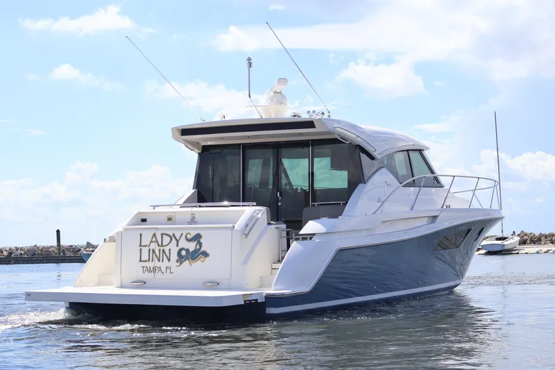 Slide: The Image of 2020 Tiara Yachts C44 Coupe cruising in Tampa, Florida waters. - 8