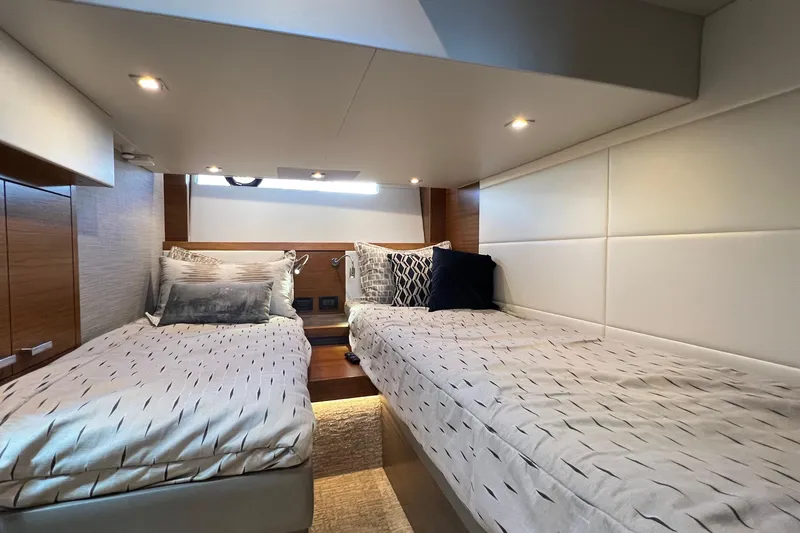 Slide: The Image of Interior cabin of 2020 Tiara Yachts C44 Coupe with twin beds and modern decor. - 89