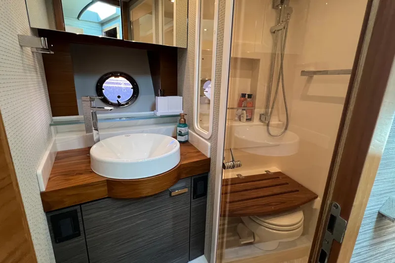 Slide: The Image of 2020 Tiara Yachts C44 Coupe bathroom with modern sink and shower. - 93