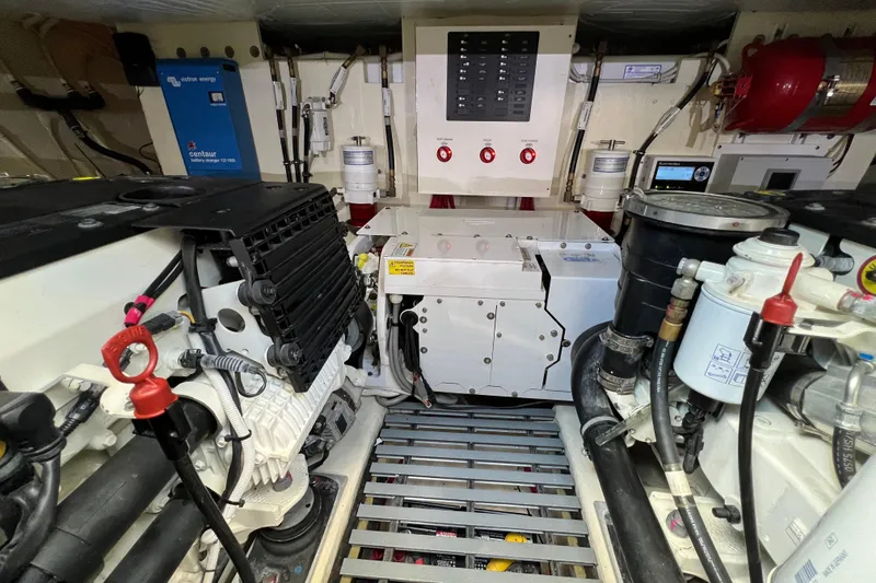 Slide: The Image of Engine room of 2020 Tiara Yachts C44 Coupe, showcasing mechanical components and systems. - 96