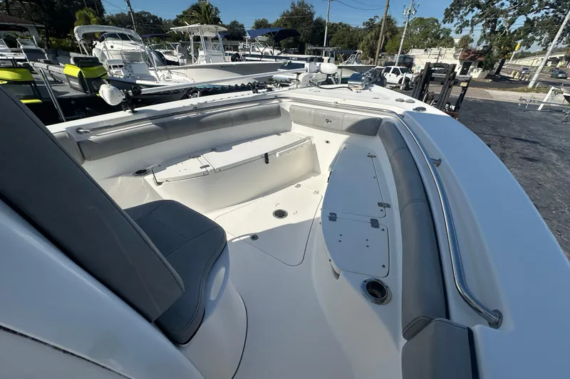Slide: The Image of 2020 Sea Pro 239 Center Console boat interior with seating and storage compartments. - 11