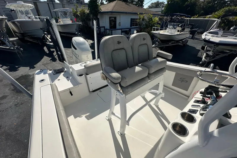 Slide: The Image of 2020 Sea Pro 239 Center Console boat interior with dual seats and control panel. - 18
