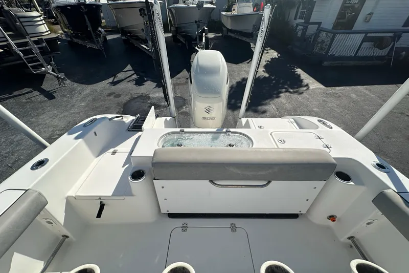 Slide: The Image of 2020 Sea Pro 239 Center Console boat with Suzuki 300 engine, docked outdoors. - 21