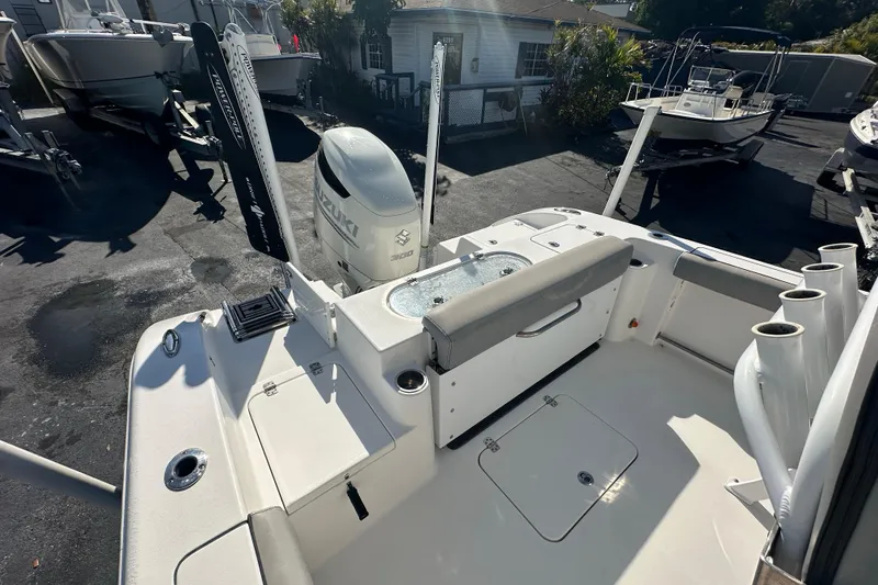 Slide: The Image of 2020 Sea Pro 239 Center Console boat with Suzuki engine, docked in a marina. - 22