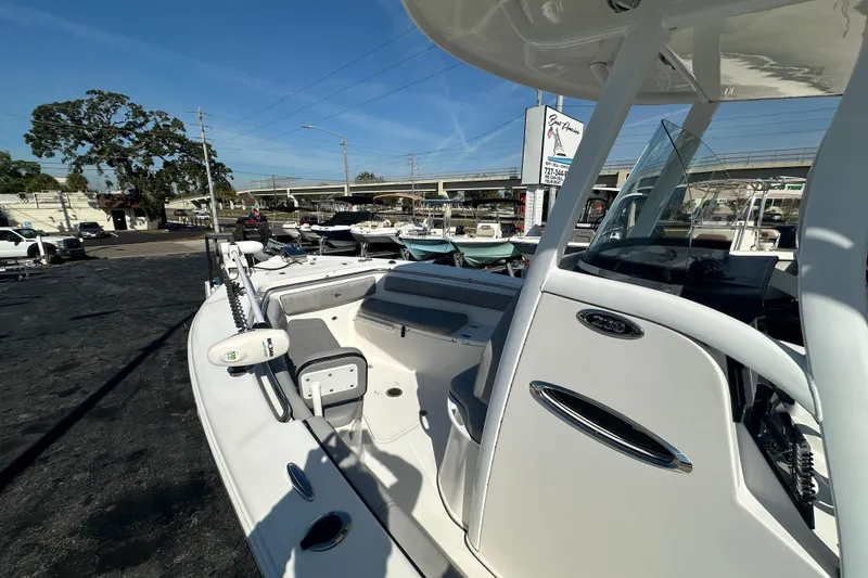 Slide: The Image of 2020 Sea Pro 239 Center Console boat displayed outdoors on a sunny day. - 27