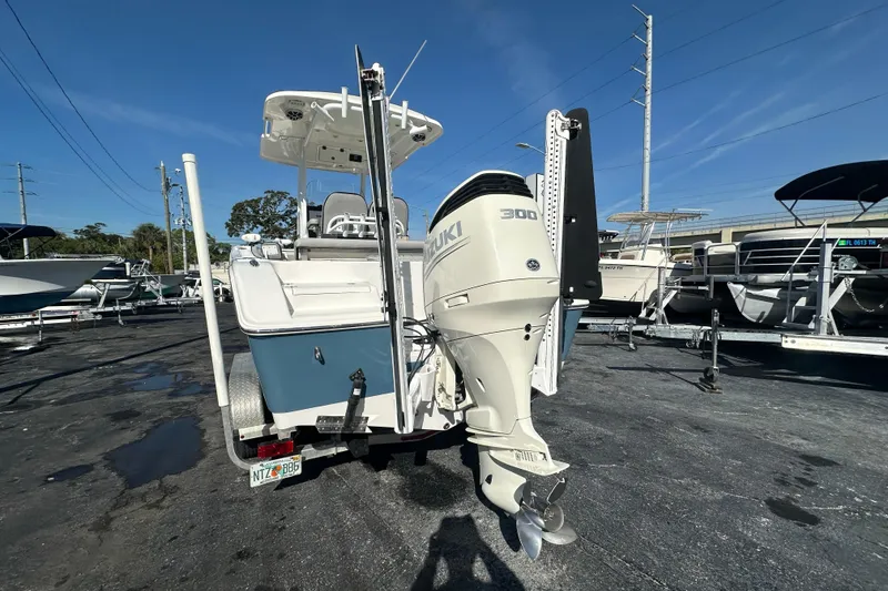 Slide: The Image of 2020 Sea Pro 239 Center Console boat with Suzuki 300 outboard motor, parked on a trailer. - 3