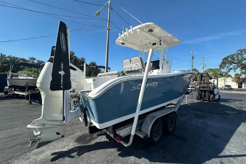 Slide: The Image of 2020 Sea Pro 239 Center Console boat on trailer, featuring a Suzuki outboard motor. - 5