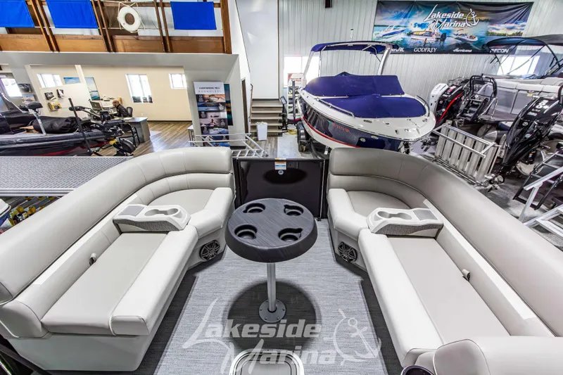 Slide: The Image of 2026 Godfrey Sweetwater 2286 SFLX pontoon boat interior at Lakeside Marina showroom. - 13