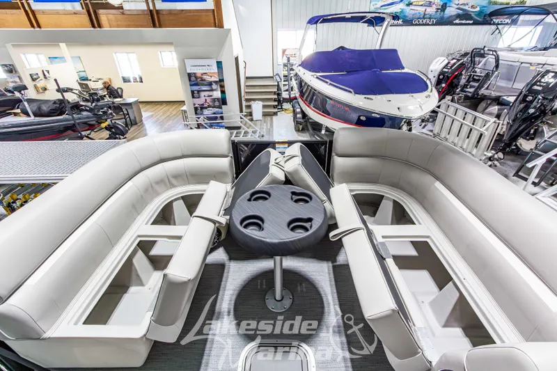 Slide: The Image of Interior view of 2026 Godfrey Sweetwater 2286 SFLX pontoon boat with seating and table. - 15
