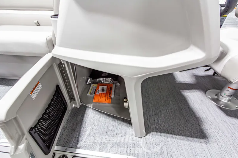 Slide: The Image of Open storage compartment in 2026 Godfrey Sweetwater 2286 SFLX boat interior. - 17