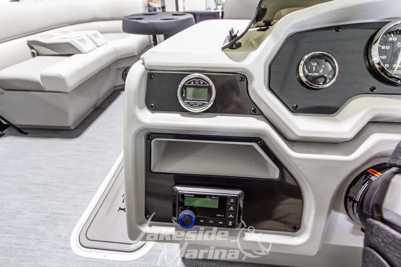 Slide: The Image of 2026 Godfrey Sweetwater 2286 SFLX boat dashboard with gauges and controls. - 22