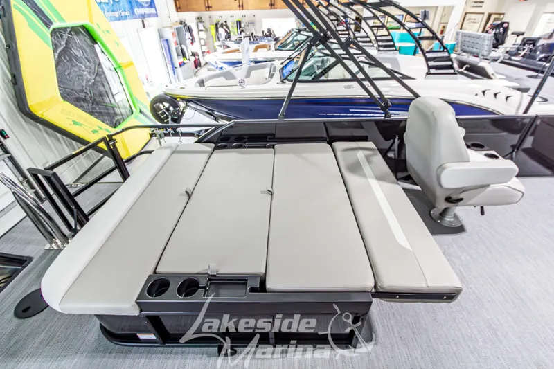 Slide: The Image of 2026 Godfrey Sweetwater 2286 SFLX pontoon boat interior with seating and cup holders. - 28