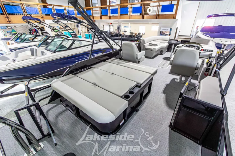 Slide: The Image of 2026 Godfrey Sweetwater 2286 SFLX pontoon boat interior at Lakeside Marina showroom. - 29
