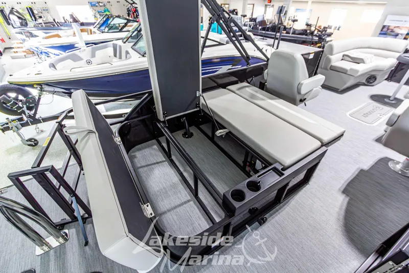Slide: The Image of 2026 Godfrey Sweetwater 2286 SFLX boat interior with seating and cup holders at Lakeside Marina. - 30