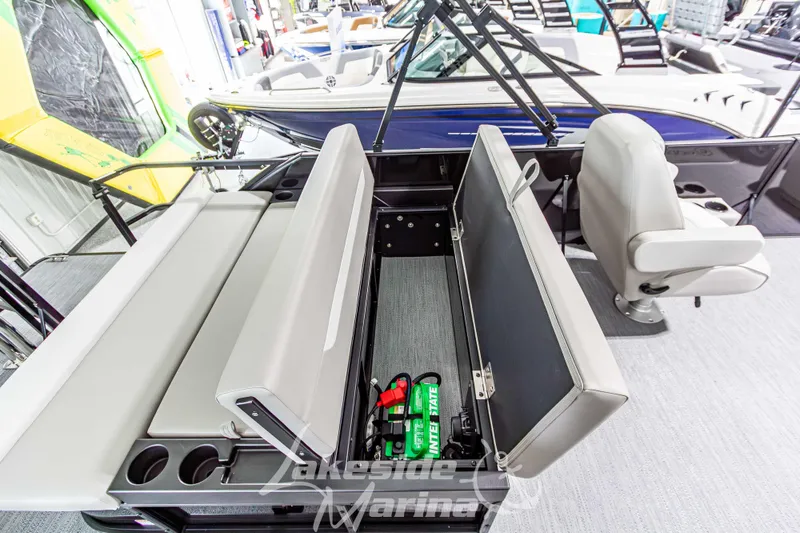 Slide: The Image of 2026 Godfrey Sweetwater 2286 SFLX pontoon boat interior with storage compartment open. - 31