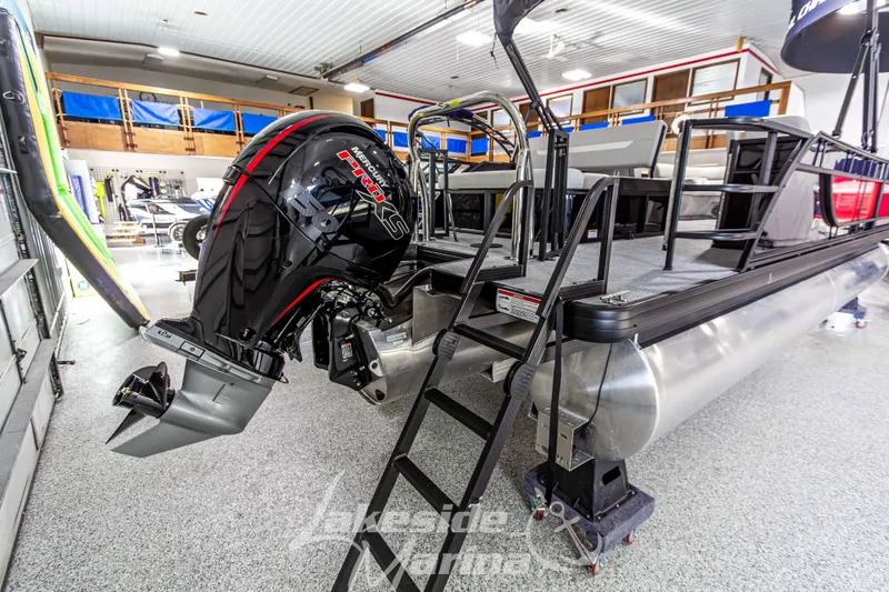 Slide: The Image of 2026 Godfrey Sweetwater 2286 SFLX pontoon boat with Mercury Pro XS engine in showroom. - 6