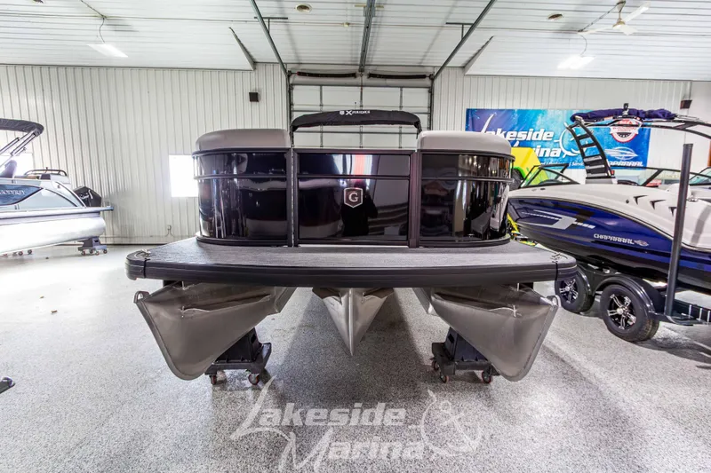 Slide: The Image of 2026 Godfrey Sweetwater 2286 SFLX pontoon boat displayed in a showroom. - 9