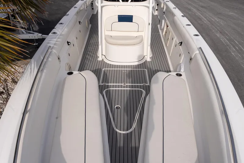 Slide: The Image of 2007 Wellcraft 35 Tournament boat, spacious deck, parked at marina with palm trees. - 16