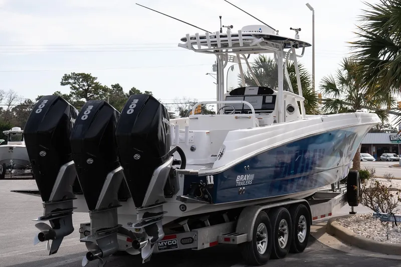 Slide: The Image of 2007 Wellcraft 35 Tournament boat with triple Mercury engines on a trailer. - 6
