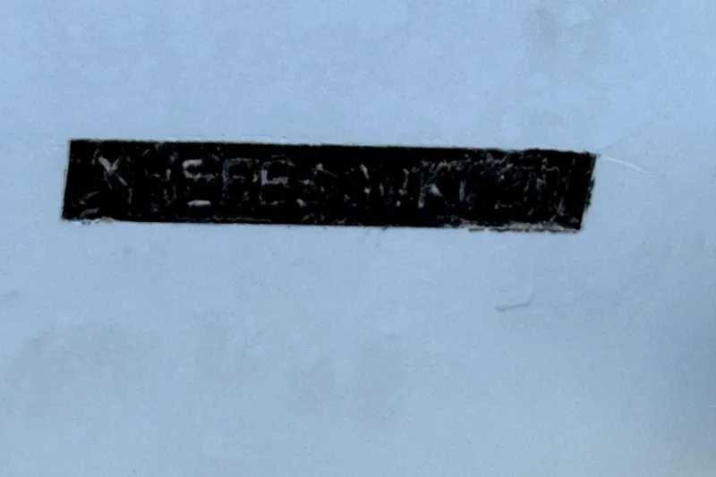 Slide: The Image of 2021 Key West 239 FS boat hull identification number on white surface. - 13