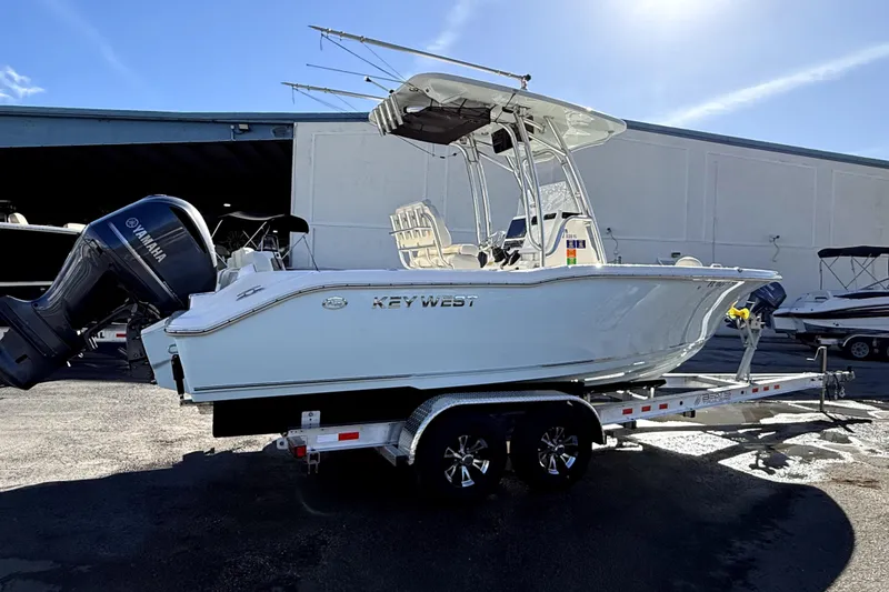 Slide: The Image of 2021 Key West 239 FS boat on trailer with Yamaha outboard motor. - 2
