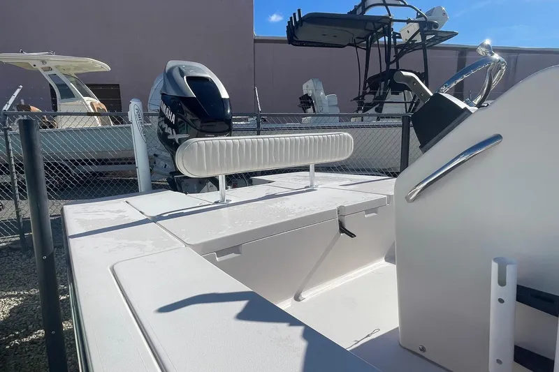 Slide: The Image of 2004 Maverick Master Angler 18 boat with Yamaha engine, parked outdoors. - 7