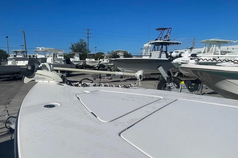 Slide: The Image of 2004 Maverick Master Angler 18 boat in a marina, surrounded by other vessels. - 8