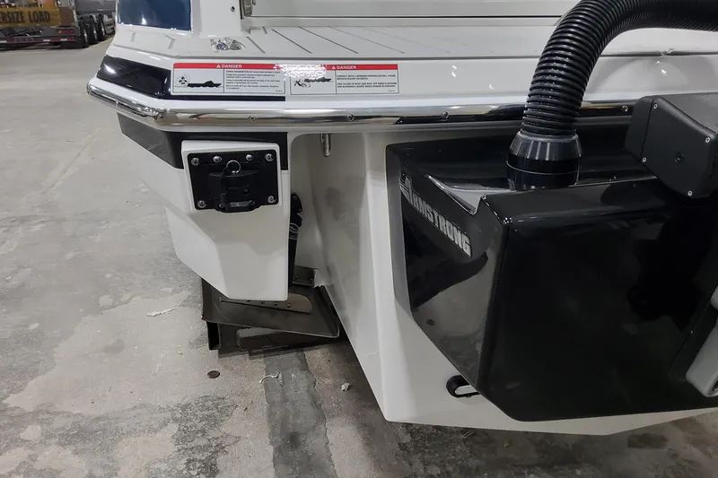 Slide: The Image of 2026 Formula 330 Crossover Bowrider OB rear view, featuring Armstrong bracket and safety labels. - 11