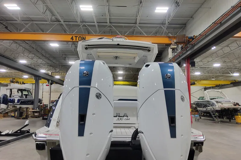 Slide: The Image of 2026 Formula 330 Crossover Bowrider OB in a boat manufacturing facility. - 15