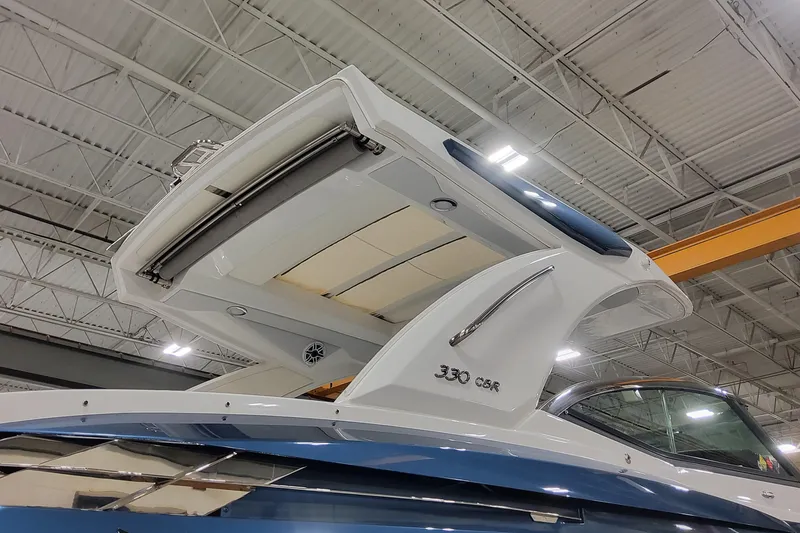 Slide: The Image of 2026 Formula 330 Crossover Bowrider OB in showroom, showcasing sleek design and modern features. - 3