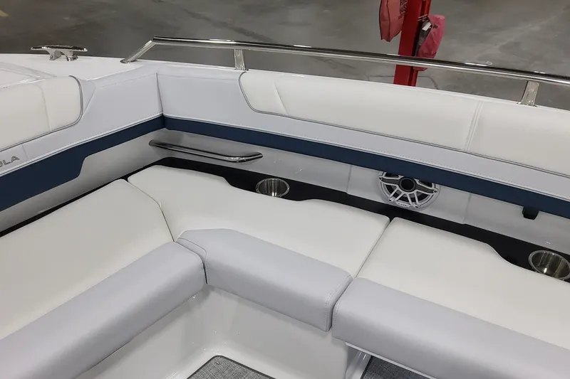Slide: The Image of 2026 Formula 330 Crossover Bowrider OB interior with white seating and speaker system. - 30