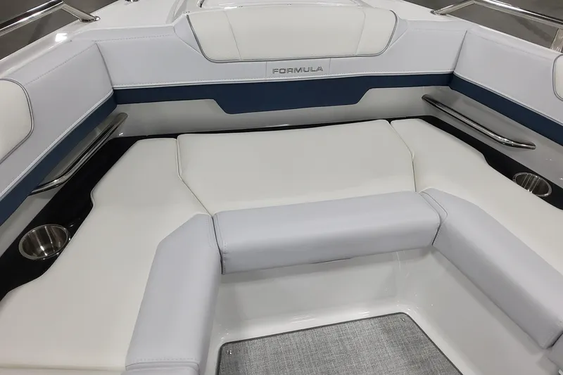Slide: The Image of 2026 Formula 330 Crossover Bowrider OB interior with white seating and cup holders. - 31