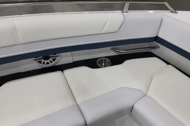 Slide: The Image of 2026 Formula 330 Crossover Bowrider OB interior with white seating and speaker detail. - 32